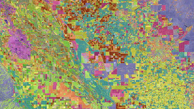A multi-colored aerial image in blue, green, red, and pink that identify parcels of land 