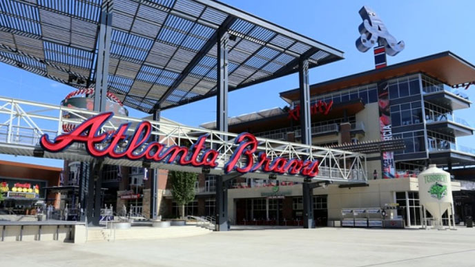 Exterior of a baseball stadium with a large red Atlanta Braves sign