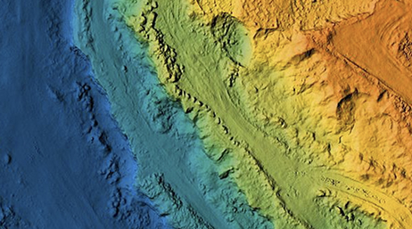 A contour map of the ocean floor with different depths shaded a rainbow of colors