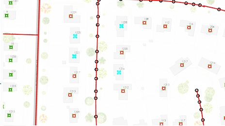 Mapa que muestra las calles como líneas y los edificios como entidades de punto en varios colores