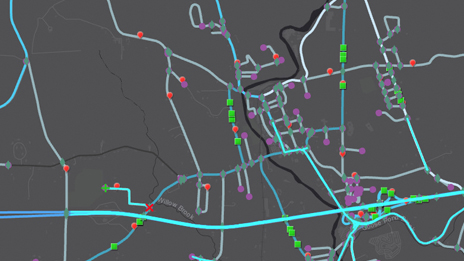 Mapa con tema oscuro en que se muestran varias líneas y puntos de datos interconectados que representan carreteras con puntos 
