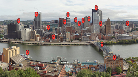 A city skyline with multiple red map markers identifying different structures