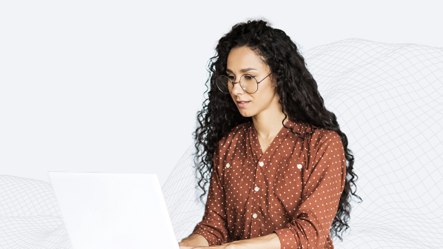 Young woman with glasses using laptop
