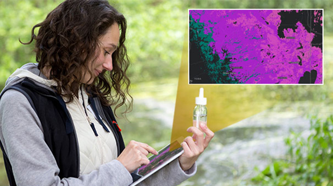 Person holding a water sample and using a tablet computer outdoors and a map in the right corner showing what’s on her screen