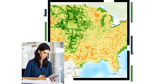 A green and yellow map of the United States, a person in business attire working on a tablet