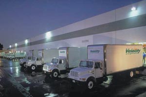 photo of Velocity Express trucks parked overnight at the loading dock