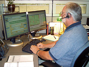 a CSR working at his computer