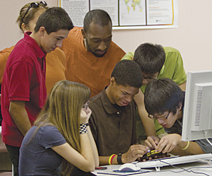 photo of teenagers learning at a computer