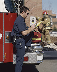 photo of a fireman using a mobile unit