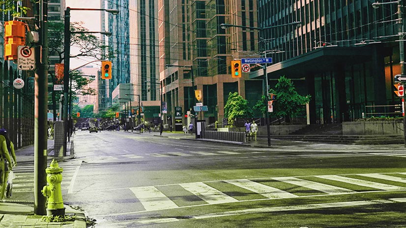 A city with pedestrians and shoppers returning