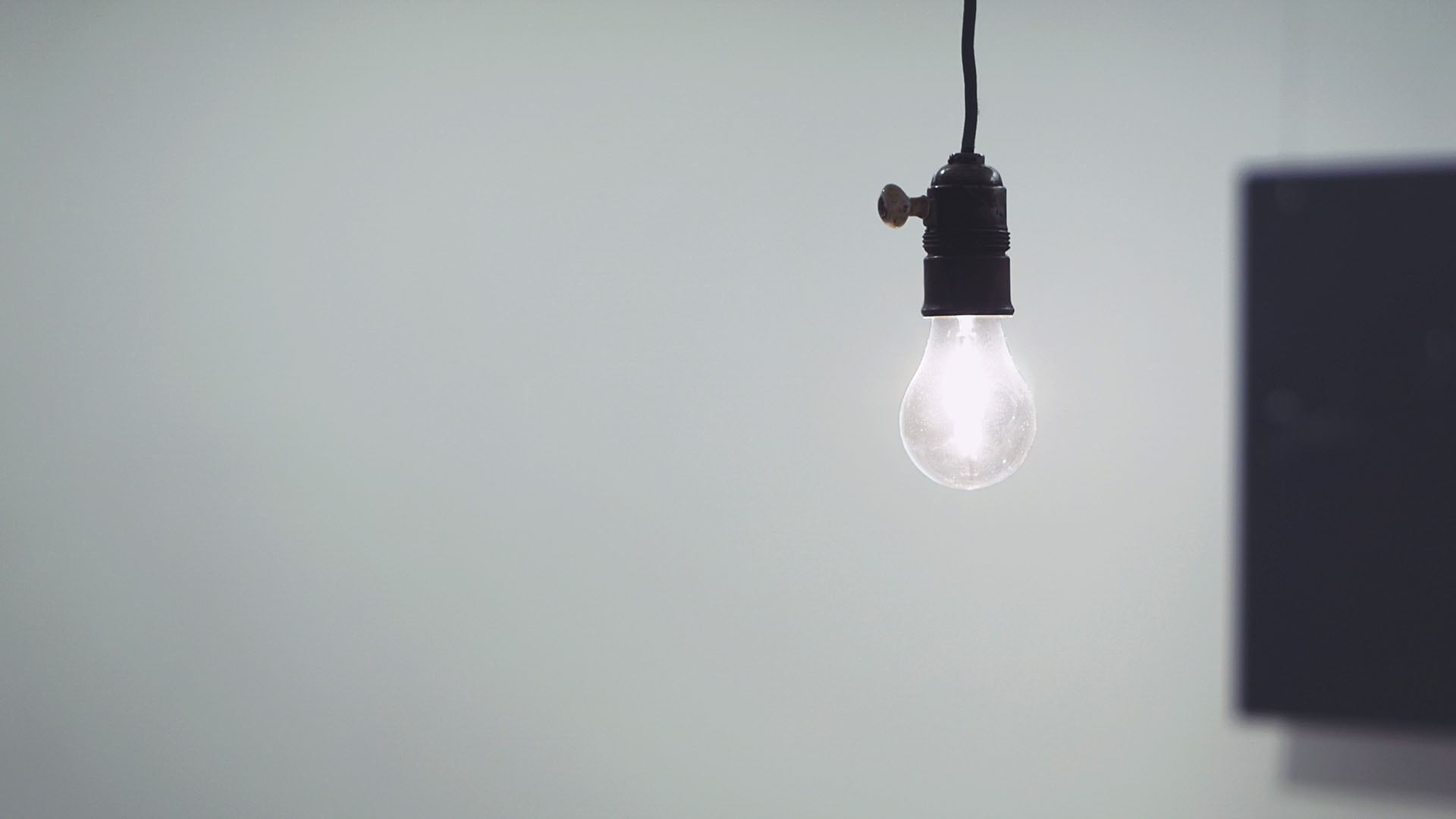 A lightbulb represents a new idea for analytics centers of excellence