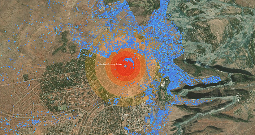 A map of Victoria Falls that centers on Baobab Primary School (represented by a bright red circle) and displays tracking points for the elephant (represented by blue dots), which show the elephant both outside and inside the red circle