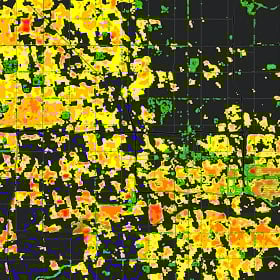 a black basemap with areas of yellow and green