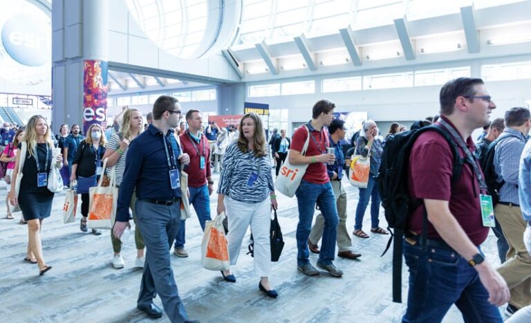 A crowd of people walking through the halls of the San Diego Convention Center