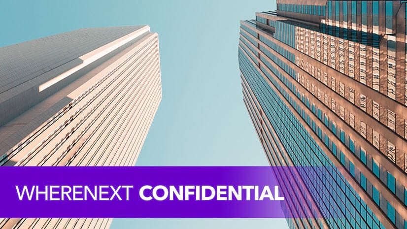 Two office towers stretching toward the sky