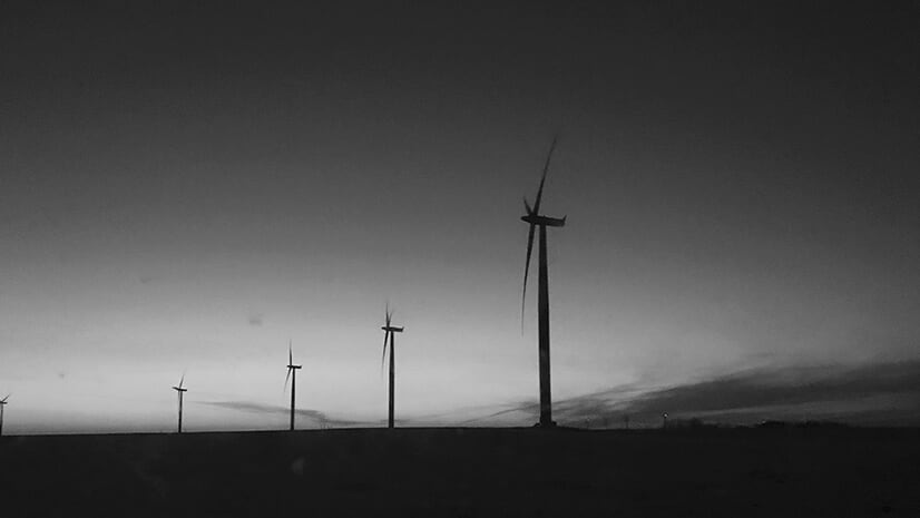 Wind turbines indicate renewable energy providers like NextEra Energy