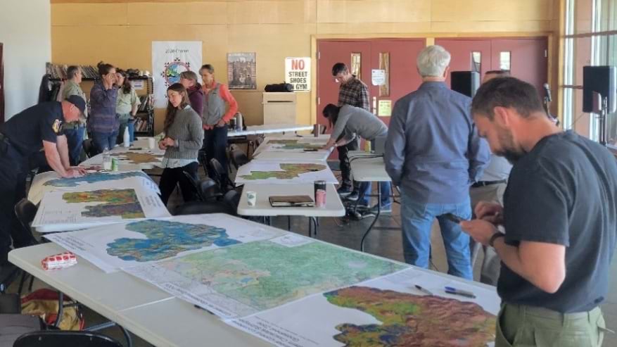 Many maps on tables being talked about