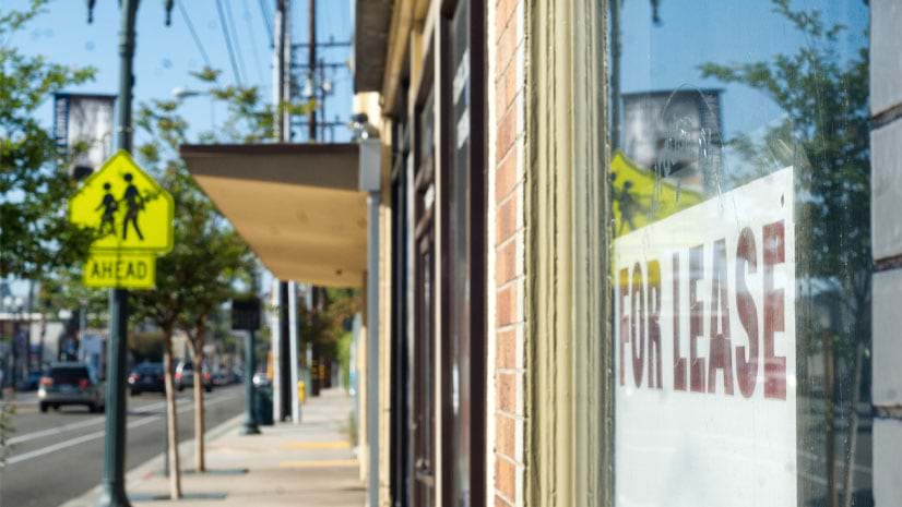 The low retail vacancy rate may not be apparent in this \'For Lease\' sign in a storefront window.