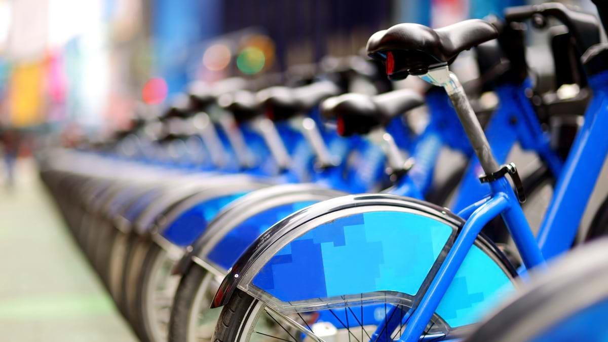 Row of city bikes for rent at docking stations