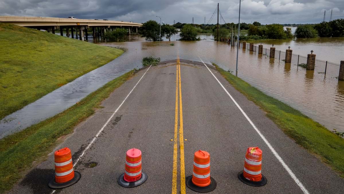 Road cones blocking flooded road