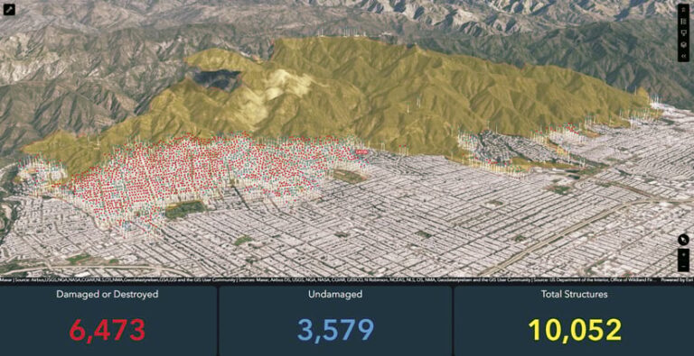 Aerial 3D map depicting the damage assessment of a residential area following a disaster. Red markers indicate 6,473 damaged or destroyed structures, while other markers show 3,579 undamaged structures, for a total of 10,052 structures. The map shows a hilly landscape with the affected area in a valley.