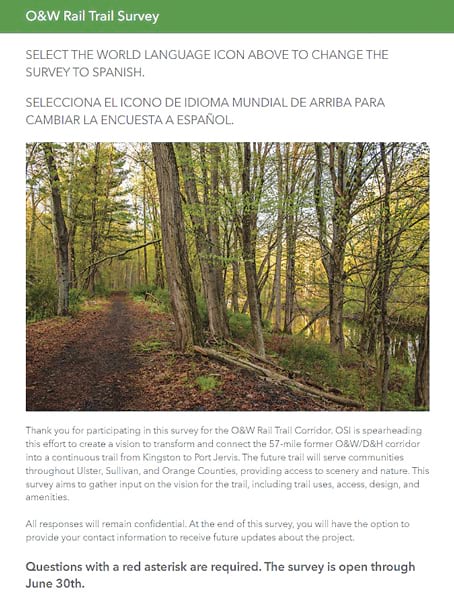 A screenshot of an ArcGIS Survey123 form that centers on a photo of a wooded trail winding through trees and has text related to the O&W Rail Trail Survey above and below the photo.