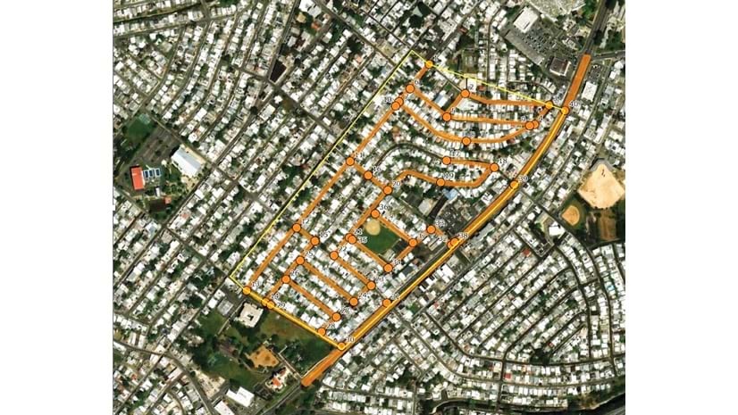 Aerial view of a residential neighborhood with numbered points highlighted along a main road and adjacent streets. The numbered points appear to mark locations or points of interest within the area.