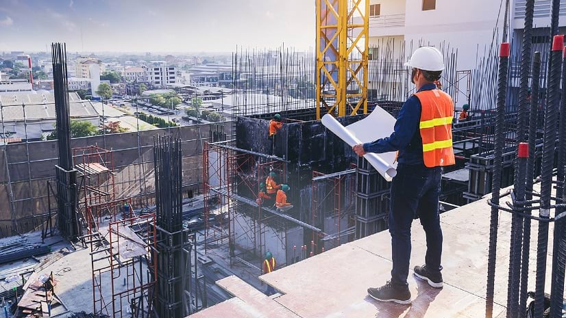 A construction worker viewing a blueprint