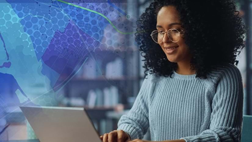 A professional young woman working on a laptop