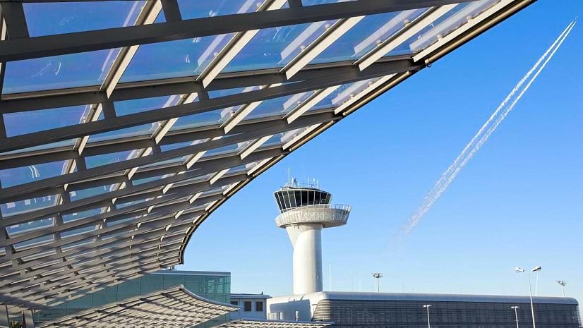 View of a blue sky and an airport\'s air traffic control tower