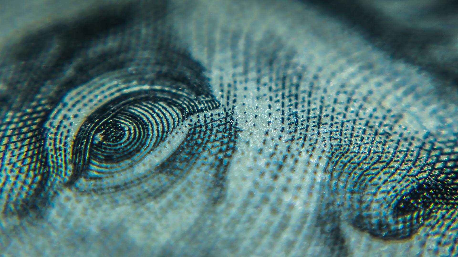 A close view of a hundred dollar bill represents consumer sentiment