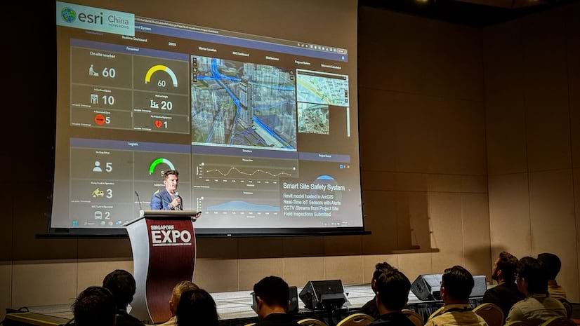 A man speaking at a podium on stage in front of a crowd