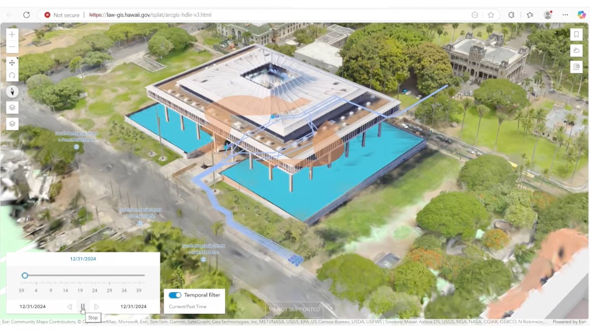 Hawaii state capitol digital twin showing temporal analysis with blue evacuation flow paths overlaid on the building. A timeline slider at bottom displays 12/31/2024 with temporal filter controls, demonstrating how emergency responses can be replayed for after-action analysis.