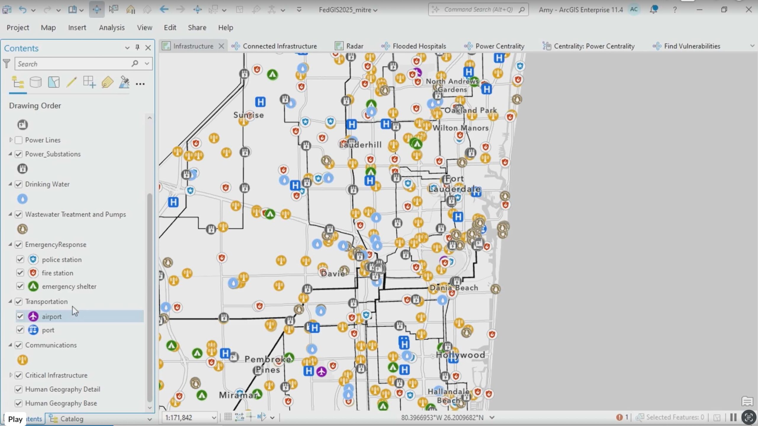 Interactive map of Fort Lauderdale showing hundreds of color-coded infrastructure points (hospitals in blue, power facilities in orange, emergency services in purple) with connecting lines illustrating interdependencies between critical systems across the urban area.