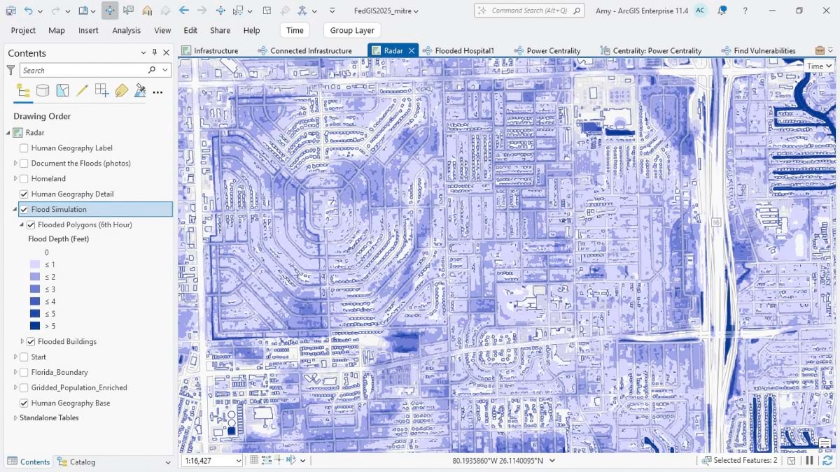 Detailed flood simulation map showing residential neighborhoods with varying depths of blue indicating flood levels from 1-5+ feet. The interface shows layered flood data analysis with building footprints and street networks overlaid on aerial imagery.