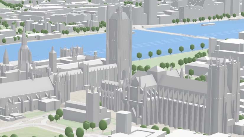 3D image of a town with gray buildings, green trees, and blue water