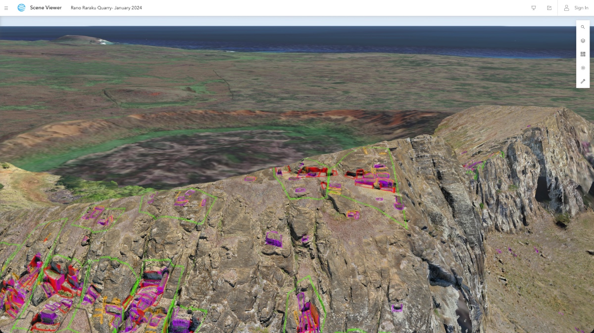 Close view of volcanic cliff face with highlighted moai carvings still embedded in rock and scattered across quarry floor.