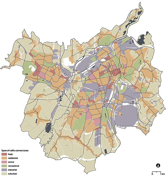 A color-coded map outlines traffic-calmed zones in a city. The legend shows the zones: lively, residential, school, recreational, industrial, and suburban. Various areas are distinguished by color, indicating zone types. The layout also features roads and a body of water, all within a defined border. The scale is indicated as one kilometer.