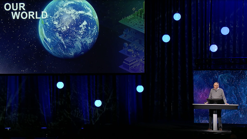 Esri president and founder Jack Dangermond standing on the Plenary stage at the Infrastructure Management & GIS Conference