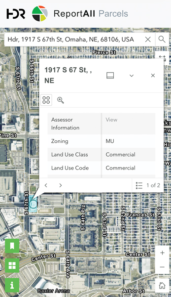 A screenshot of the ReportAll Parcels map, showing a highlighted parcel at 1917 S 67th Street NE, zoned MU, commercial land use.