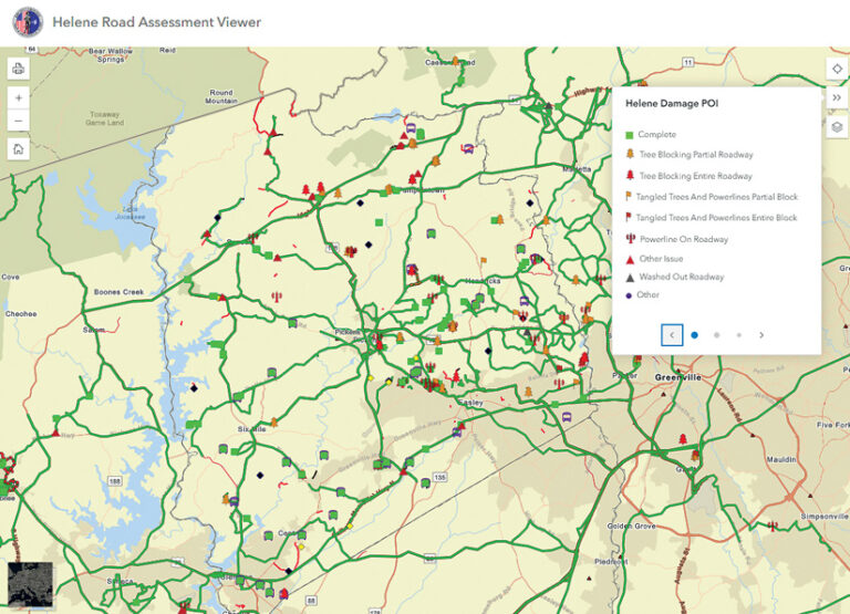 A screenshot of the "Helene Road Assessment Viewer" digital map. Roads display icons indicating storm damage: tree blockages, tangled powerlines, and washed-out roadways, detailed in a legend.
