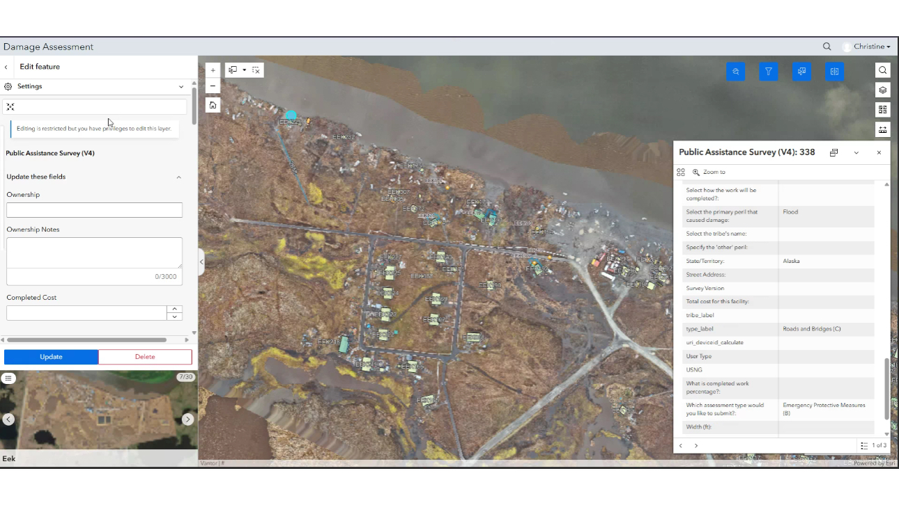 Aerial damage assessment map of Eek, Alaska showing color-coded structure markers across storm-scoured terrain, with a feature editor panel listing damage categories on the left.