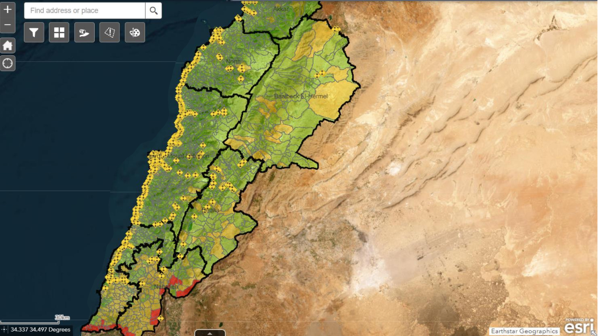 Map of Lebanon showing yellow shelter location markers across country with red conflict zones highlighted in the south