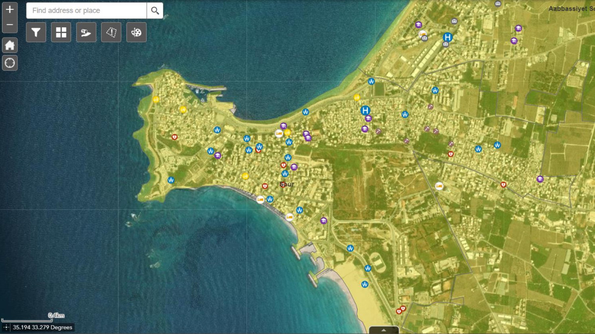 Detailed map view of Lebanese coastal city showing hospitals, shelters, and service locations marked with colored symbols along shoreline