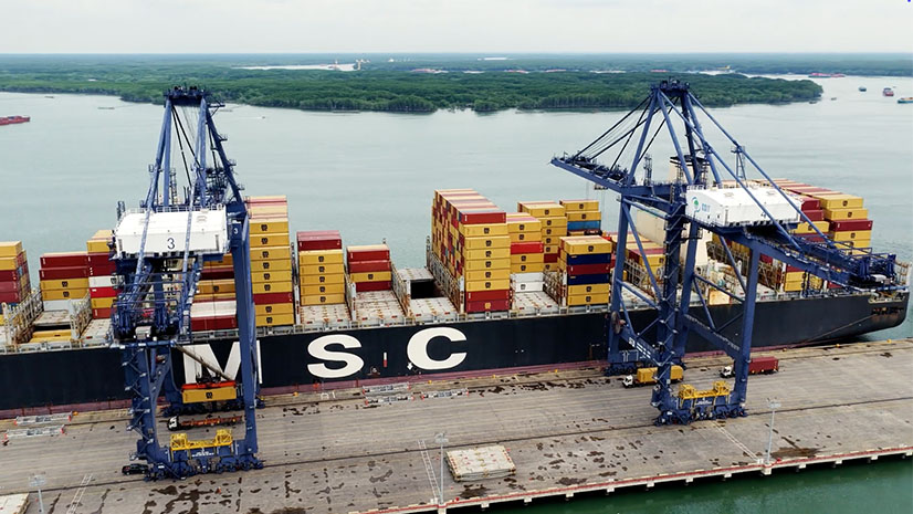 A large shipping barge docked at a port