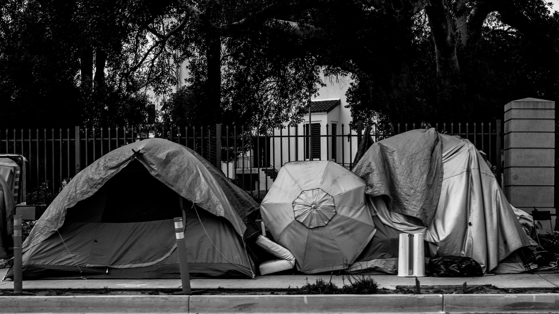 A black and white photo of a homeless encampment