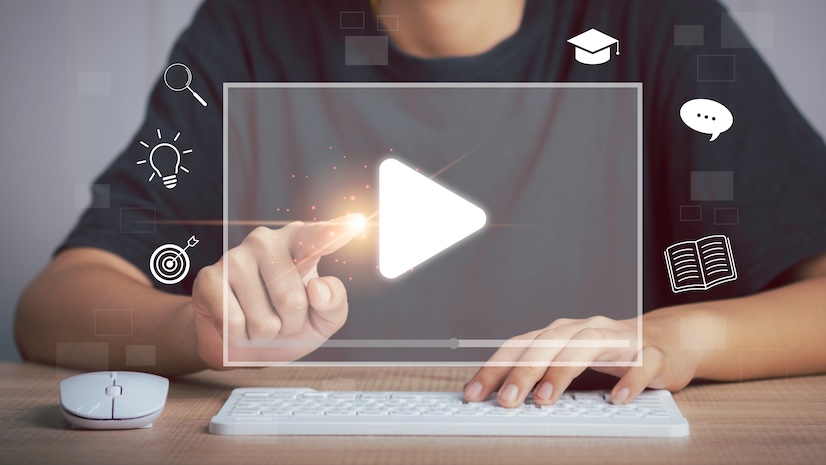 Person hand on keyboard pressing a digital play button