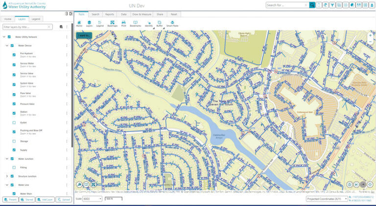 A screenshot of the Albuquerque Bernalillo County Water Utility Authority’s ArcGIS Utility Network Instance, with a map that displays blue lines for water pipes over a street grid. A left sidebar allows toggling map layers, including fire hydrants, service valves, and water mains.