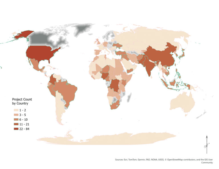 Choropleth world map displaying the number of projects per country. Countries are shaded in five shades of brown, from light tan (1–2 projects) to dark reddish-brown (22–84 projects), as shown in the legend.