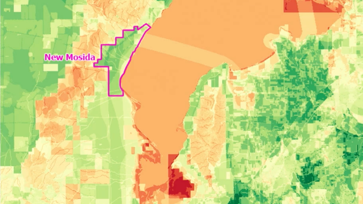 Heat map of Utah County showing New Mosida's proposed boundary in magenta against a green-to-red gradient indicating site suitability across the surrounding region.